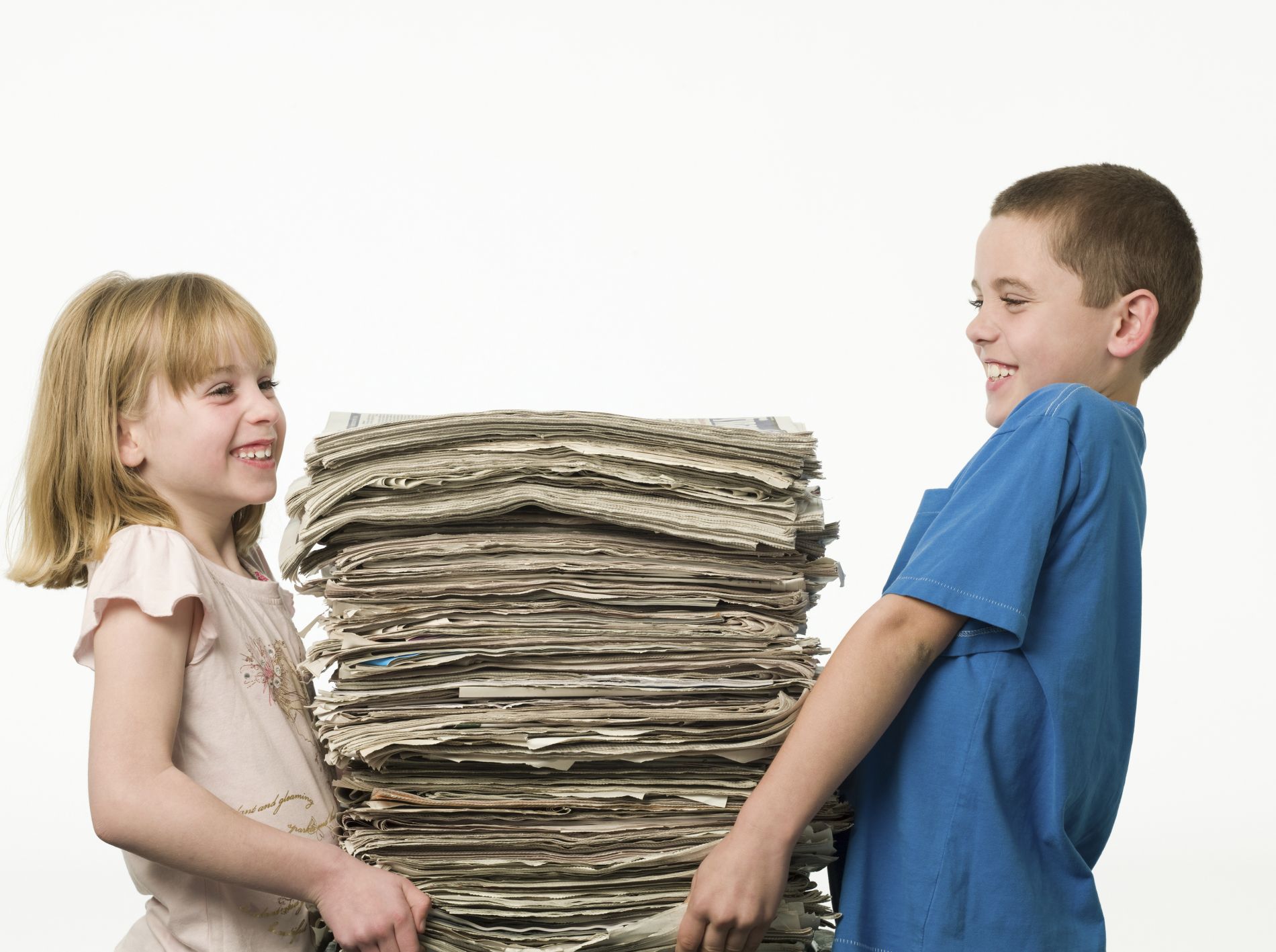 Children carrying Newspapers.